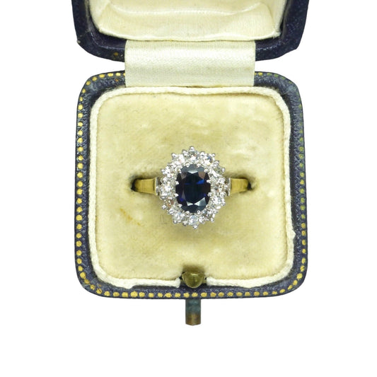 Vintage 18ct oval sapphire diamond cluster ring in a vintage ring box